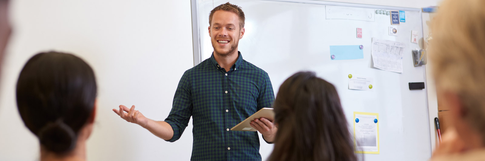 a young male delivering a class